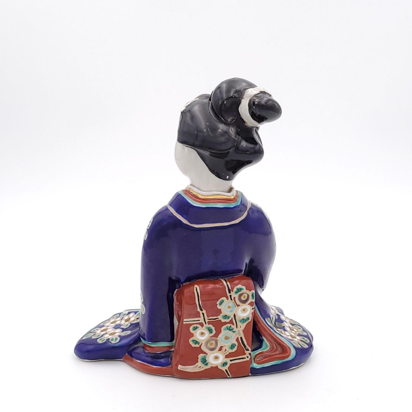 Figure of Geisha Holding a Puppy, Japan circa 1920